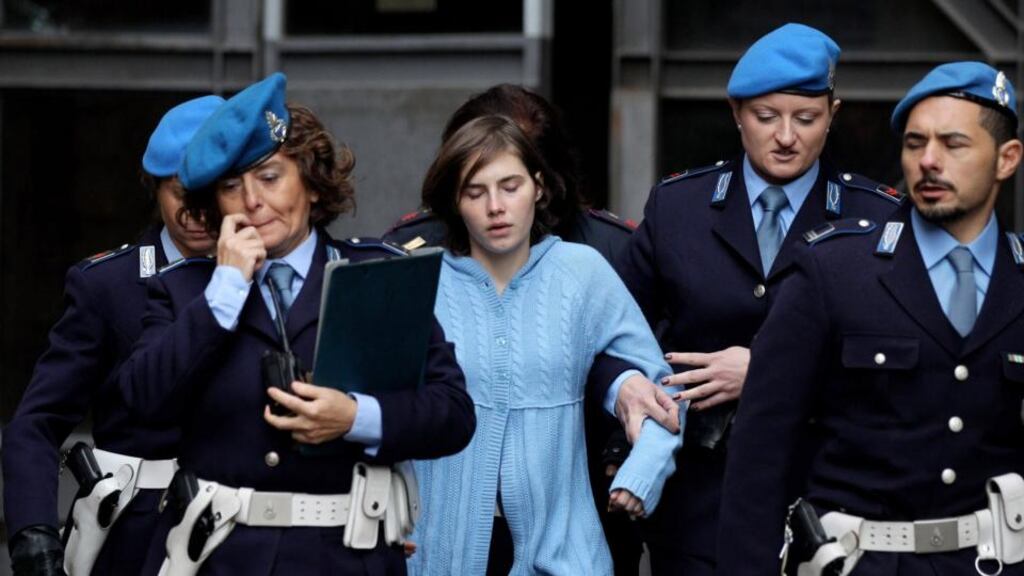 Amanda Knox is led away from Perugia's court of appeal after the first session of her appeal in November 2010. Photograph: Oli Scarff/Reuters