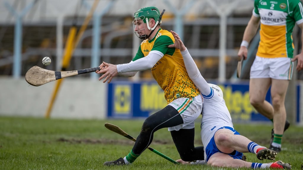 Offaly’s Eoghan Cahill is tackled by Waterford’s Shane Bennett. Photograph: Morgan Treacy/Inpho