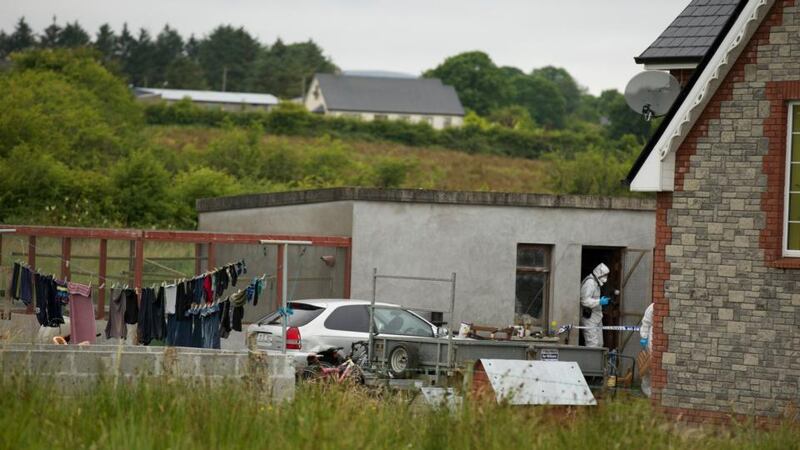 Gardaí from the Garda Technical Bureau at the house in Banada, Co Sligo, where the bodies of Shane and Brandon Skeffington were found yesterday. Photograph: Keith Heneghan