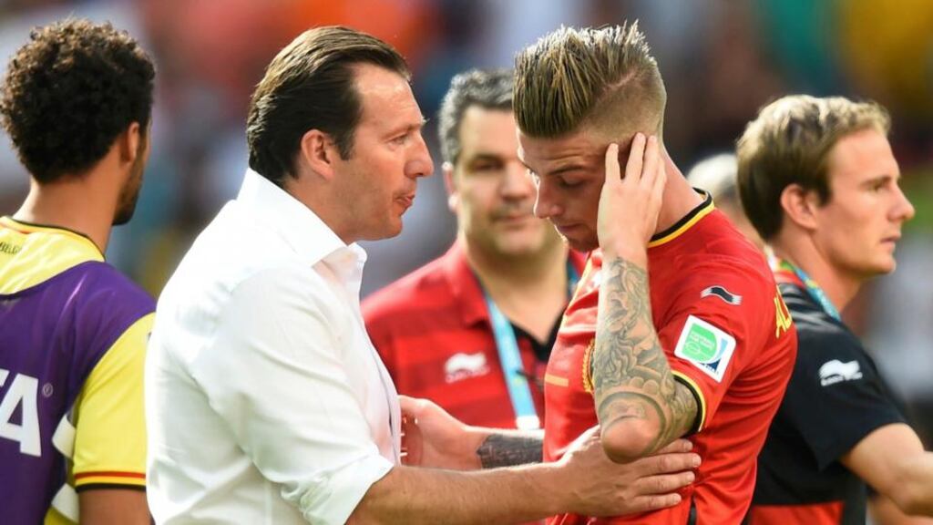 Belgium’s coach Marc Wilmots consoles Toby Alderweireld after defeat to Argentina in Brasilia. Photograph: Dylan Martinez / Reuters