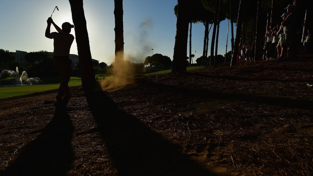 Paul Dunne attempts a recovery shotfrom the trees during the second round of the Turkish Airlines Open in Antalya. Photograph: Stuart Franklin/Getty Images