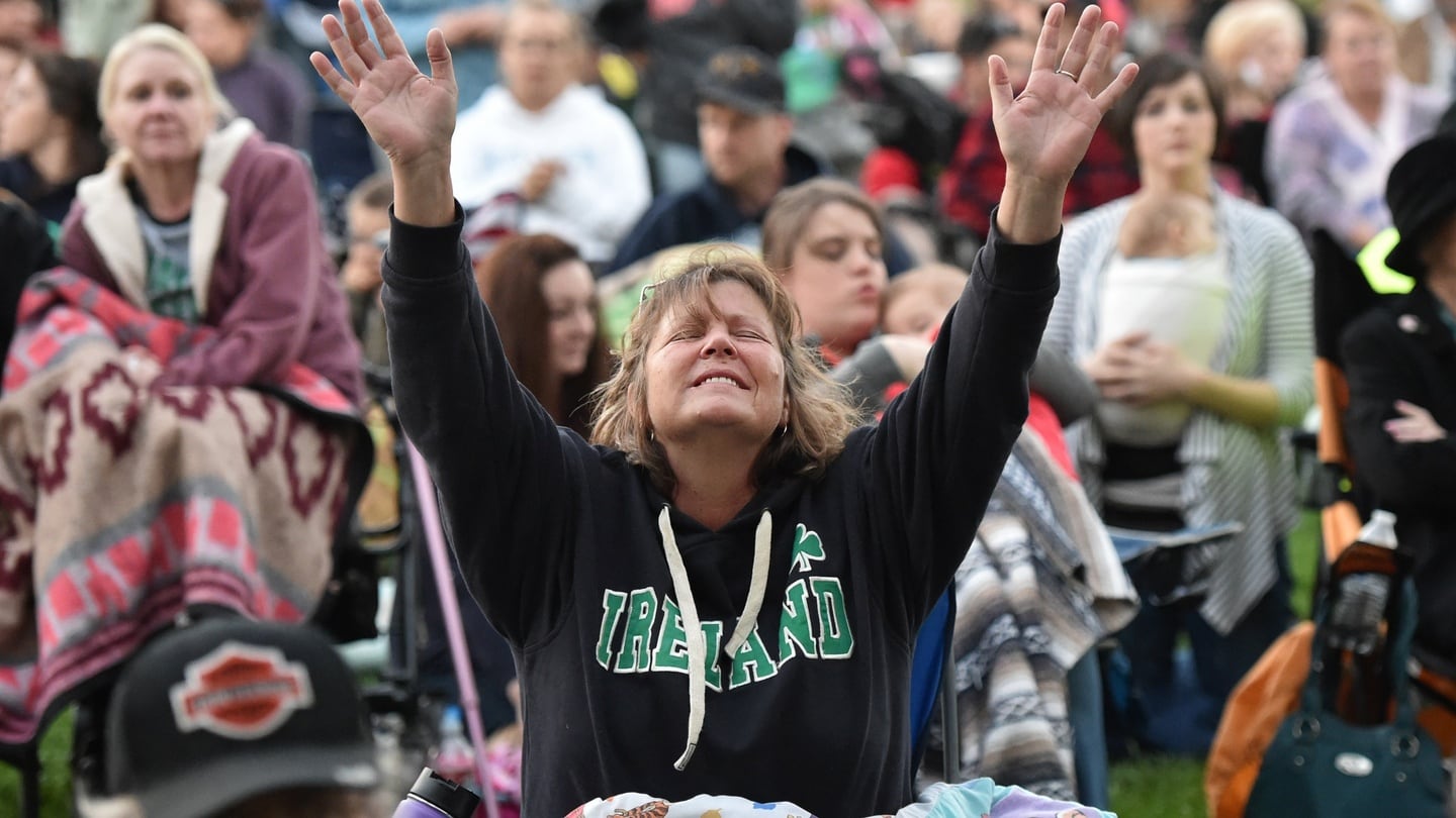Deana Butler reacts to religious music during a vigil for the victims of the Umpqua Community College shooting in Winston, Oregon, on Saturday. Photograph: AFP