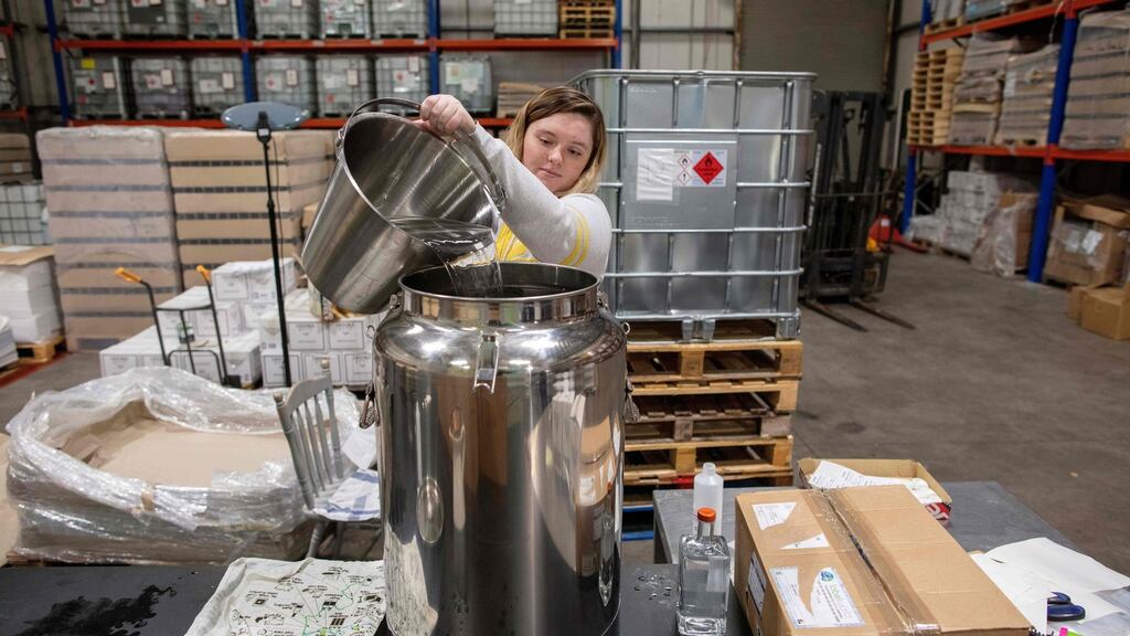 Staff prepare to bottle hand sanitiser at Listoke Distillery and Gin School. Photograph: Paul Faith/AFP via Getty