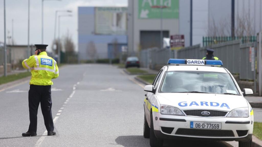 Gardaí at the scene where a man died in a shooting incident in Greenogue Industrial Estate Rathcoole, Dublin, yesterday. Photograph: Julien Behal/PA Wire