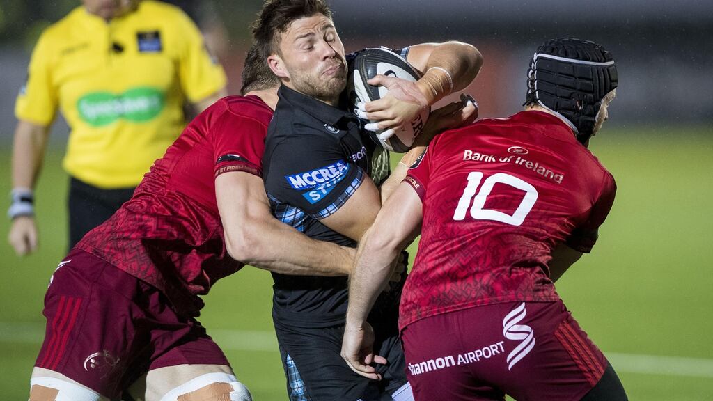 Munster’s Tommy O’Donnell and Tyler Bleyendaal tackle Ali Price of Glasgow. Photograph: Craig Watson/Inpho