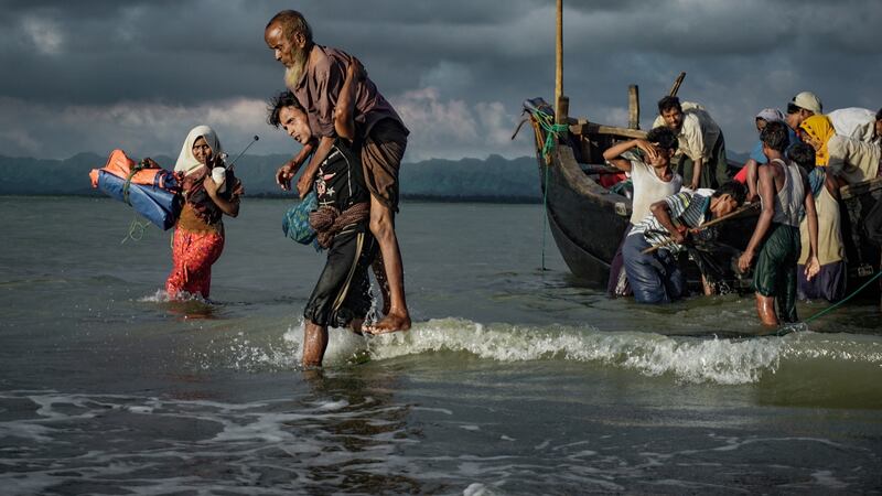 Rohingya Muslim refugees disembark from a boat on the Bangladeshi side of Naf river in Teknaf. Photograph: Masfiqur Sohan/NurPhoto via Getty Images