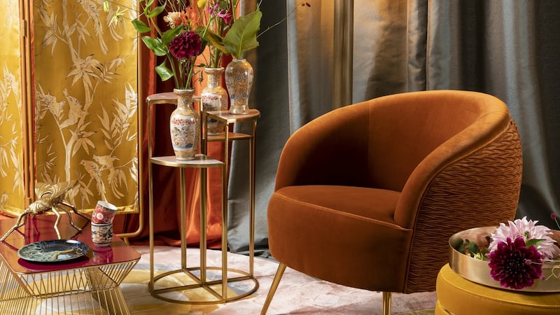Burnt orange upholstery will bring in an amber element. Dublin-based April and the Bear has a selection of occasion chairs in the shade.
