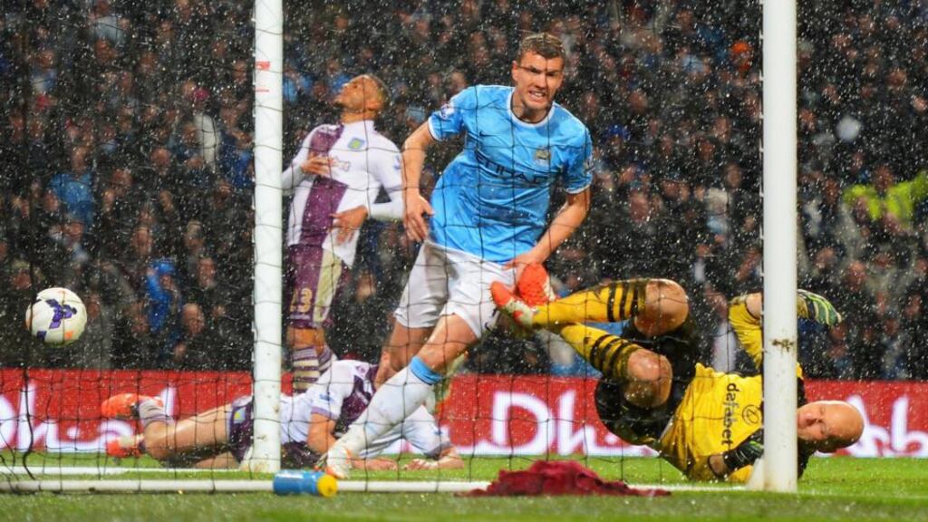 Edin Dzeko of Manchester City celebrates scoring the opening goal during their Premier League match against Aston Villa at Etihad Stadium, Manchester. Photograph: Michael Regan/Getty Images