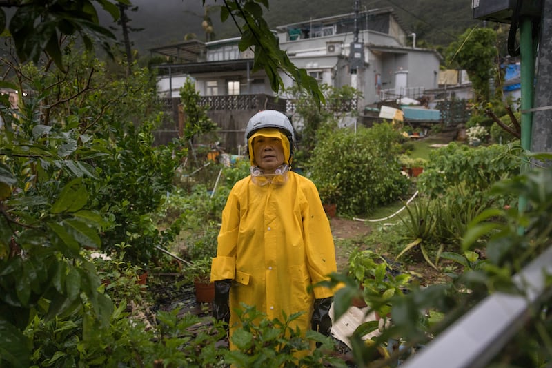A resident checks her garden in the aftermath of Ragasa in a coastal village in Hong Kong on September 24th.Photograph: Dale De La Rey/AFP via Getty