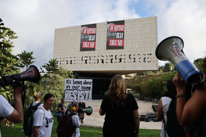 Protestors in Jerusalem hang Hebrew signs with the words 'abandoned and also killed!' during demonstrations calling on the Israeli government to sign a hostage-release and ceasefire deal. Photograph: EPA