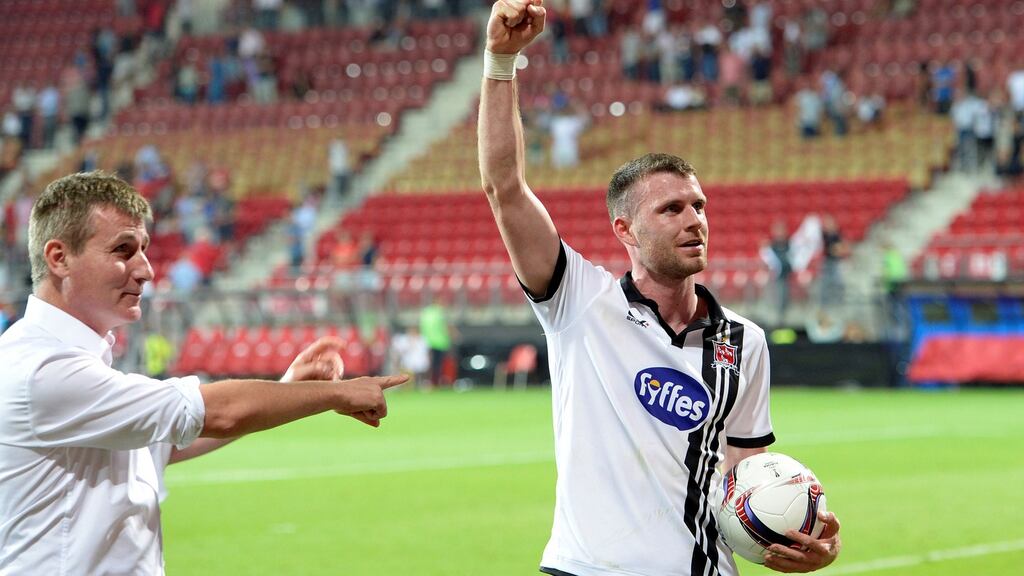 Dundalk’s Ciaran Kilduff and manager Stephen Kenny celebrate after the final whistle. Photograph: Toussaint Kluiters/Reuters
