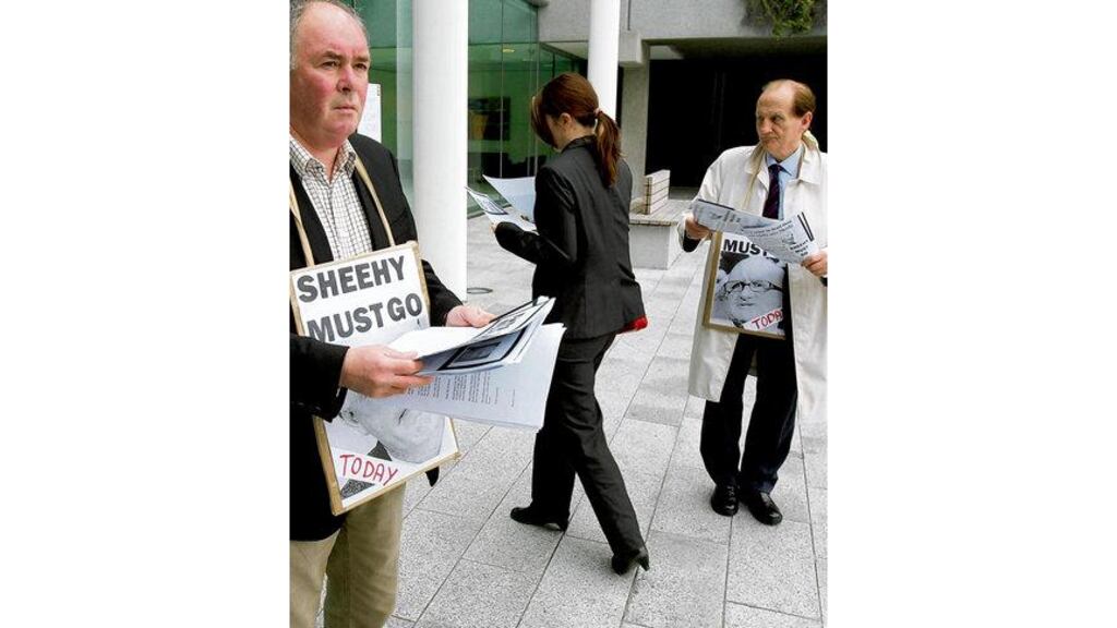 Disaffected shareholders hand out leaflets before an AIB egm in Ballsbridge, Dublin, last May. Questions remain over AIB's exposure to the Kallakis portfolio, even as it prepares to hand over €24 billion in impaired loans to Nama and further capital injections from the taxpayer look inevitable.