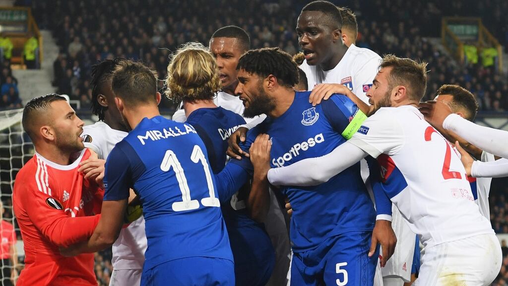 Ashley Williams clashes with Lyon players during the Europa League Group E match at Goodison Park. Photograph: Ross Kinnaird/Getty Images