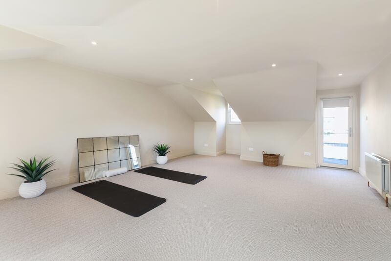 The house has a large space on the top floor with a multitude of uses