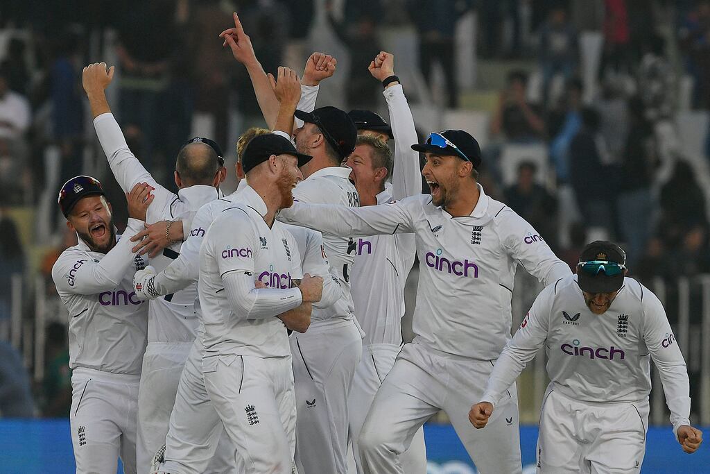 England's players celebrate after their victory at the end of the fifth and final day of the first cricket Test against Pakistan at the Rawalpindi Cricket Stadium. Photograph: Aamir Qureshi/AFP via Getty Images