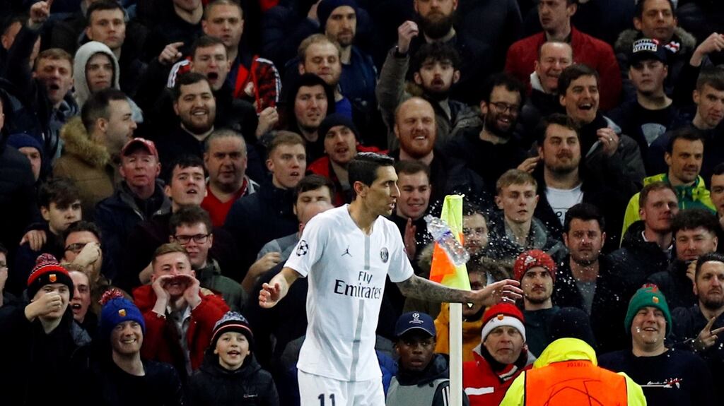 A plastic water bottle is thrown at Paris Saint-Germain’s Ángel Di María during the Champions League round of 16 first leg at Old Trafford on Tuesday night. Photograph: Phil Noble/Reuters