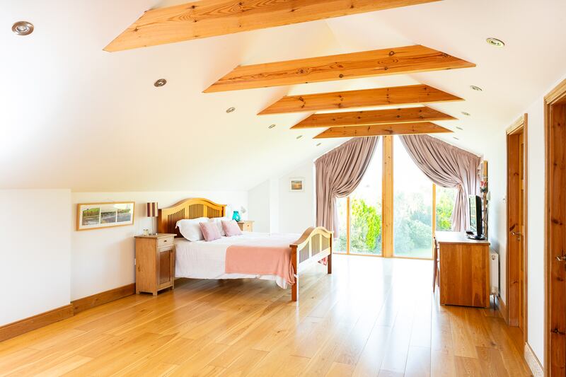 Principal bedroom with beams and solid oak floor
