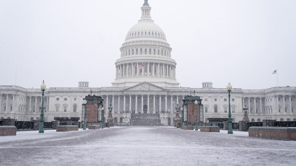 Snow falls around the US Capitol building in Washington, DC. Photograph: Anna Moneymaker/The New York Times