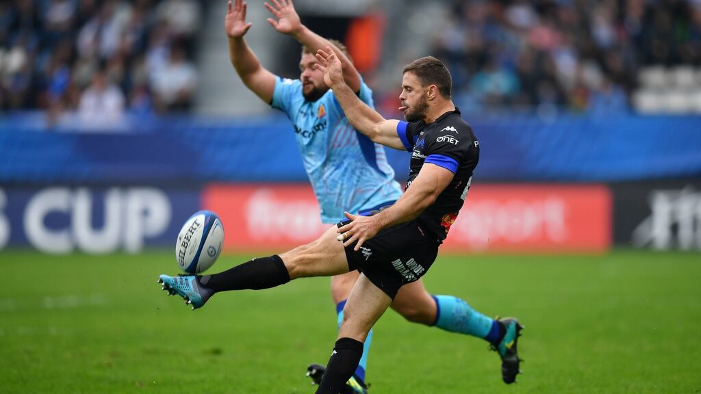 Castres’ Rory Kockott  box kicks under pressure from Tomas Francis of Exeter Chiefs during the Heineken Champions Cup match  at the Stade Pierre-Fabre. Photograph: Dan Mullan/Getty Images