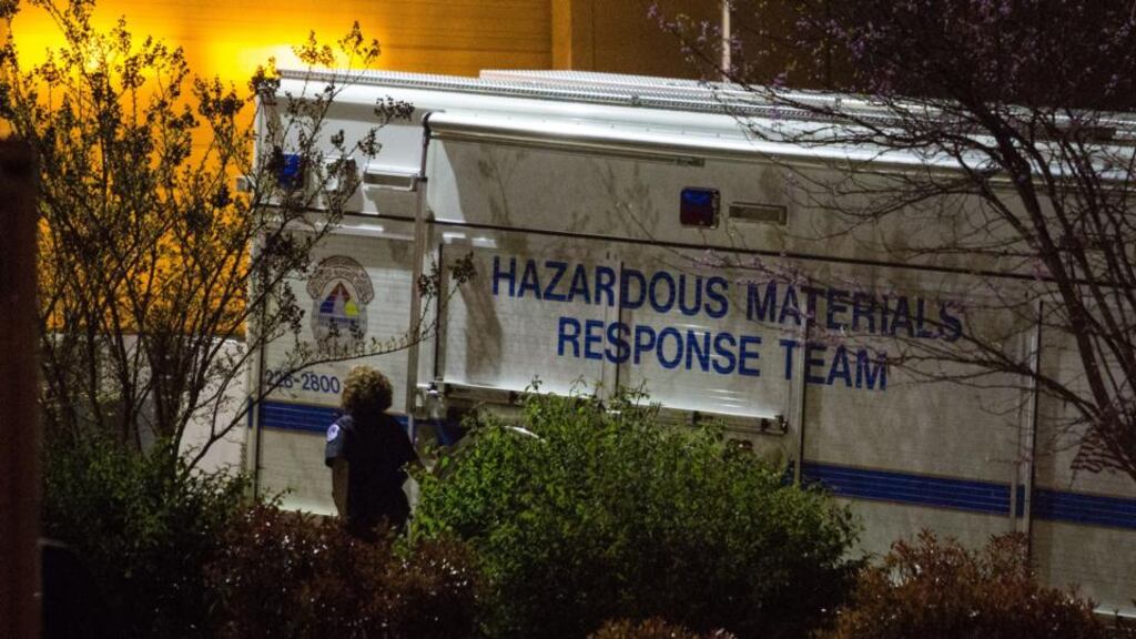 An official walks past a hazardous materials response team truck outside a mail sorting facility in Hyattsville, Maryland. An envelope addressed to US Senator Roger Wicker tested positive for ricin at the facility where mail bound for the US Capitol is sorted. Photograph: Drew Angerer/Getty Images