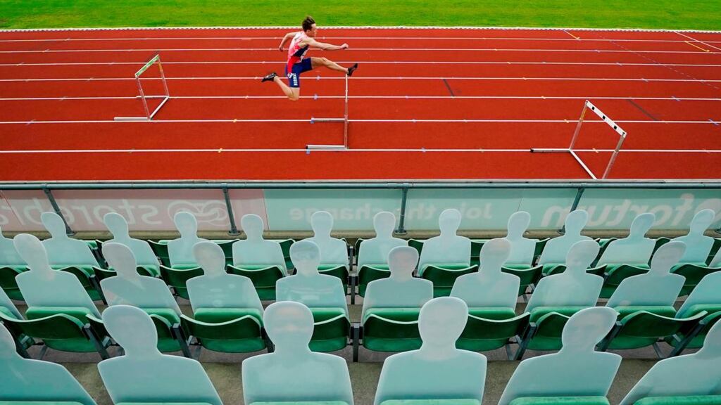 Cardboard fans are displayed in the stands as Karsten Warholm of Norway competes in the men 300m hurdles event during the Impossible Games 2020 at the Bislett Stadium in Oslo. Photograph: Heiko Junge/NTB Scanpix/AFP via Getty Images
