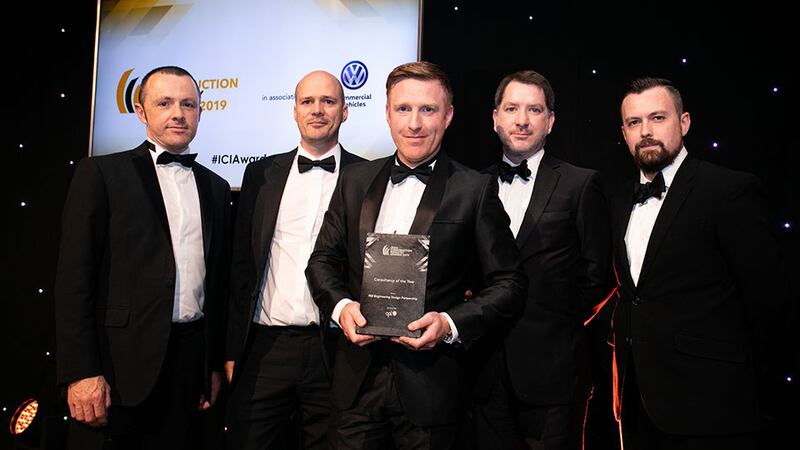 Robert Kiernan, Head of Construction, Cpl presents the Consultancy of the Year award to the IN2 Engineering team.
