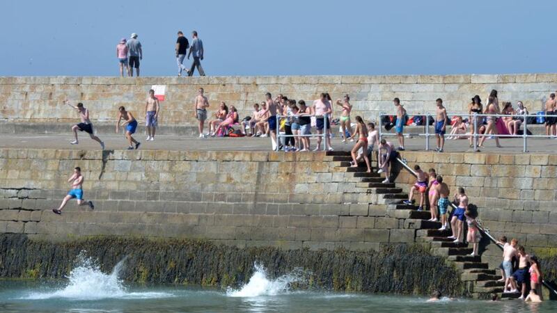 Young people enjoying the sunsine at Howth this afternoon. Photograph: Alan Betson / The Irish Times