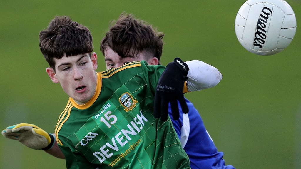 Meath’s Aaron Murphy and David Dooley of Laois. Photo: Inpho