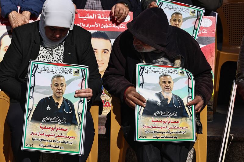 Demonstrators with placards bearing portraits of the director of the Kamal Adwan Hospital in Gaza, Hussam Abu Safiya, during a protest in solidarity with them in Ramallah city in the occupied West Bank last January. Photograph: Zain Jaafar/AFP via Getty Images