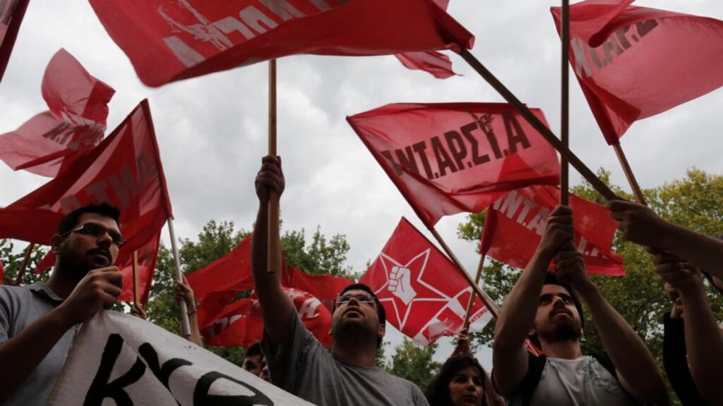 Protesters in Athen. Since the Greeks want to remain inside the eurozone, they have to bear the resultant pain.