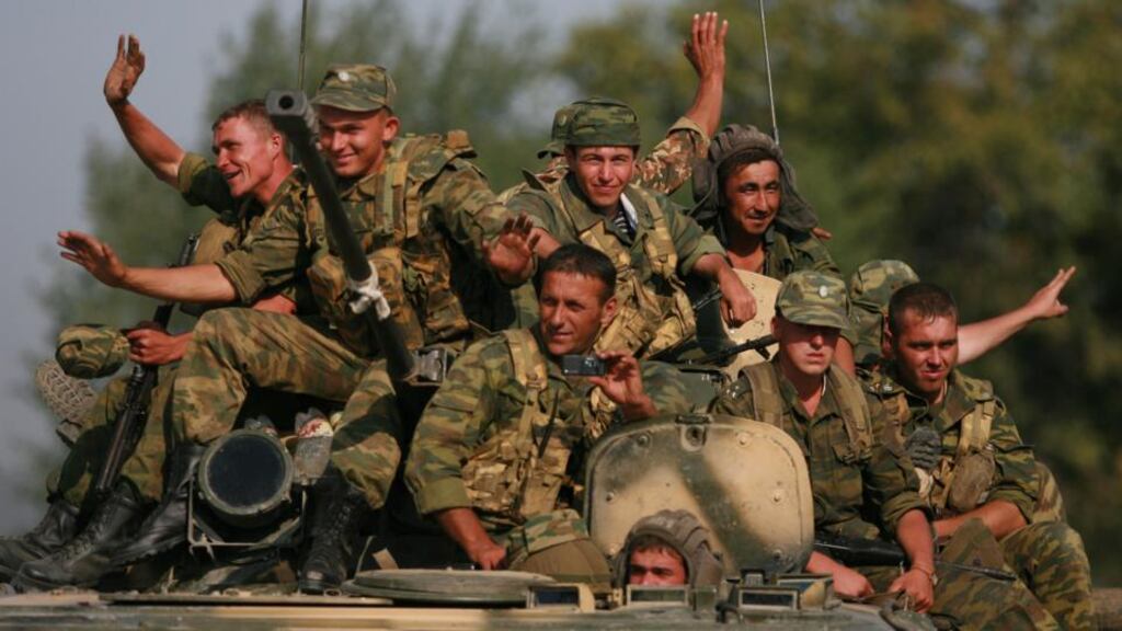 Russian soldiers riding an armoured personnel carrier on August 22nd, 2008, near Igoeti, on the road from Tbilisi to Gori, Georgia. Photograph: Uriel Sinai/Getty Images
