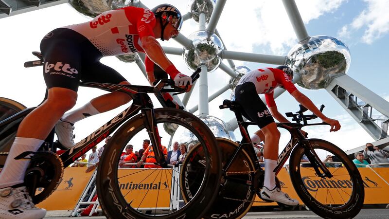 Lotto Soudal riders Jasper De Buyst of Belgium and Tiesj Benoot of Belgium pass the Atomium in Brussels. Photograph: Francois Lenoir/Reuters