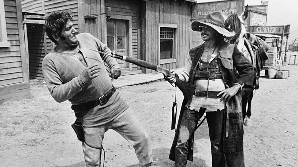 Ringo Starr points a gun at Allen Klein. Photograph: ABKCO Archive