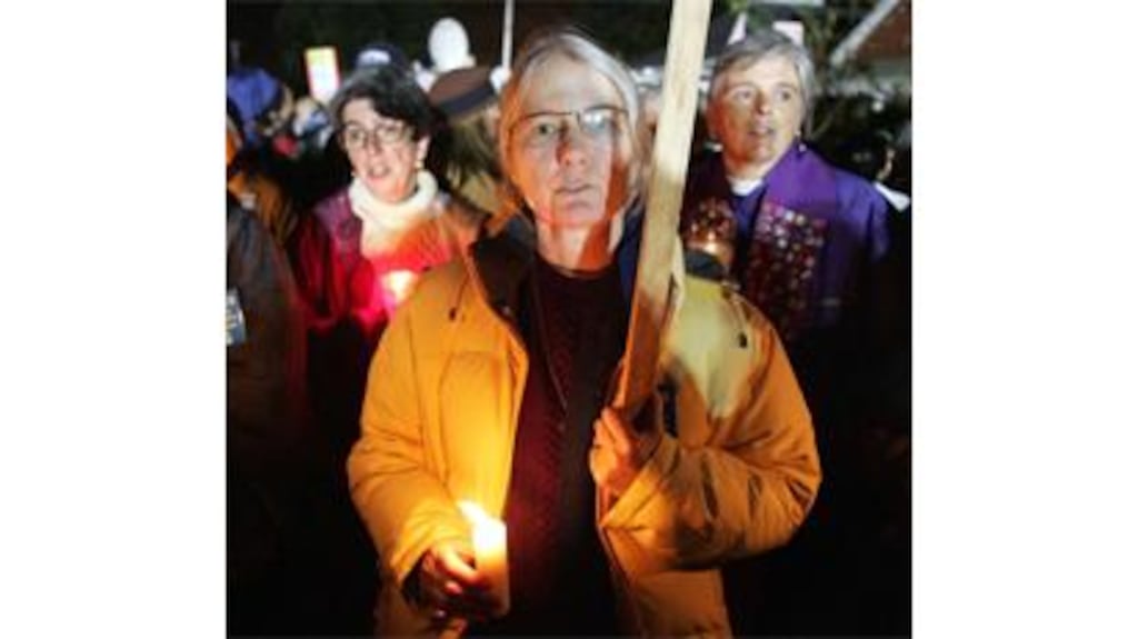 Demonstrators opposed to the death penalty sing a hymn shortly after the execution of Stanley Williams at San Quentin prison in California yesterday. State governor Arnold Schwarzenegger rejected final appeals to spare his life. Photograph: Lou Dematteis/Reuters