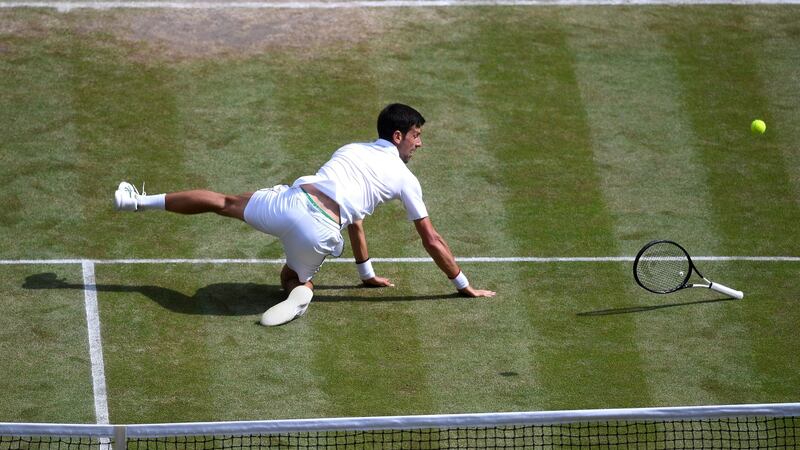 Djokovic dives in his attempt to return a shot. Photo: Laurence Griffiths/Getty Images