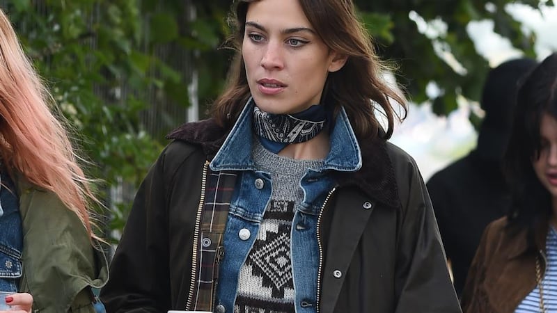 Alexa Chung at Glastonbury Festival wearing a wax jacket. Photograph: Samir Hussein