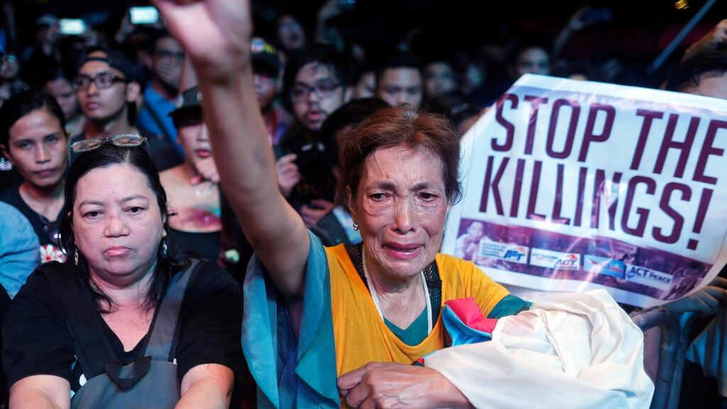 Protesters    in Manila, Philippines: signs reading “stop the killings” and “no to martial rule” reflected concerns  that  President Rodrigo  Duterte would one day deliver on his threat to declare nationwide military rule.  Photograph: Francis R Malasig/EPA