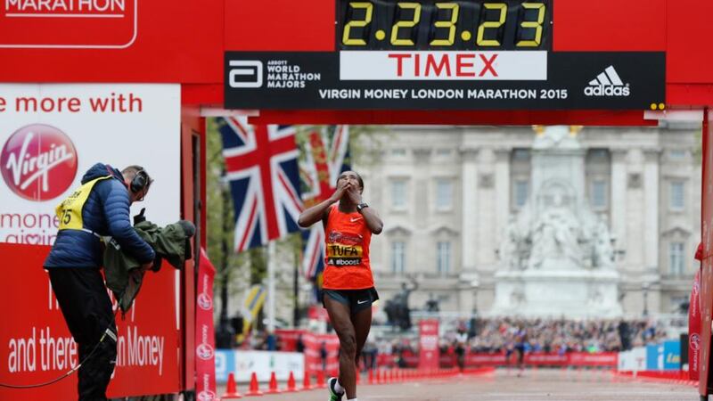 Ethiopia’s Tigist Tufa celebrates after winning the women’s elite race at the London Marathon. Photo: Suzanne Plunkett/Reuters/Livepic