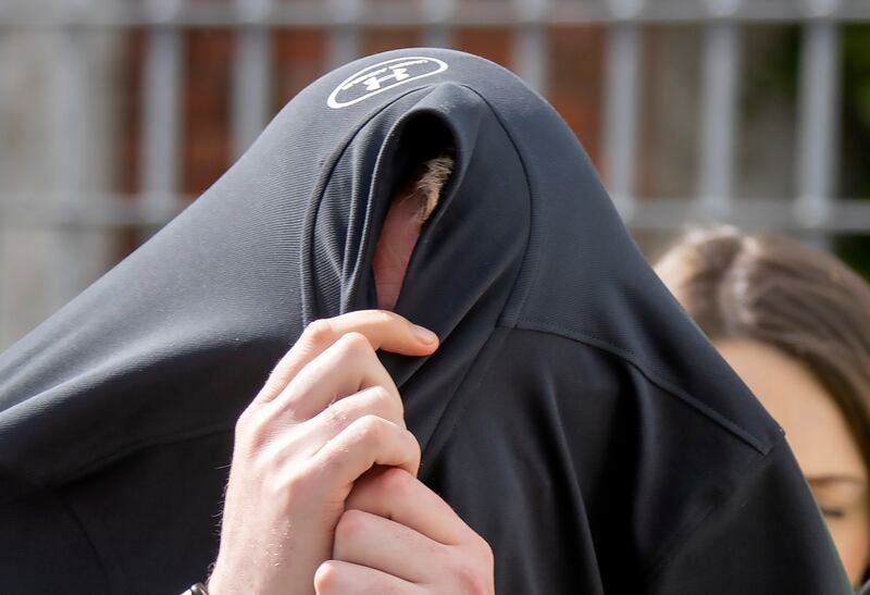 A file photograph of Dean Paget covering his face after being charged in connection with his assaults on Lisa Ward. Photograph: Colin Keegan/Collins