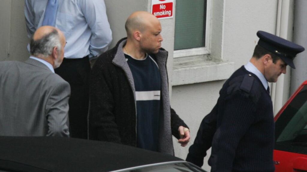 Mark Nash (centre) is taken from the Bridewell Court in Dublin after he was charged in October 2009 in connection with the killings of Sylvia Shields and Mary Callinan in Grangegorman in 1997. File photograph: Cyril Byrne/The Irish Times
