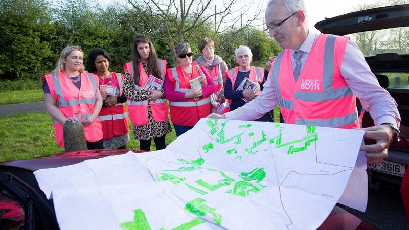 Paddy Rowland and a team of No campaigners check the area map for houses to canvass. Photograph: Tom Honan