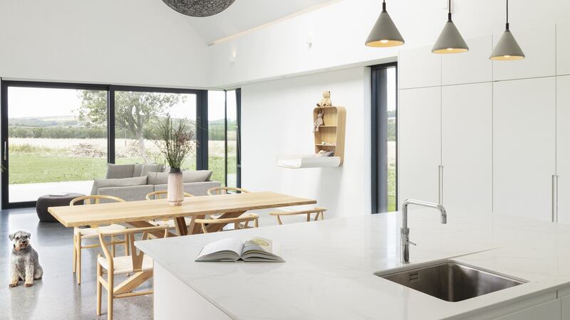 The open-plan kitchen, dining, living room.