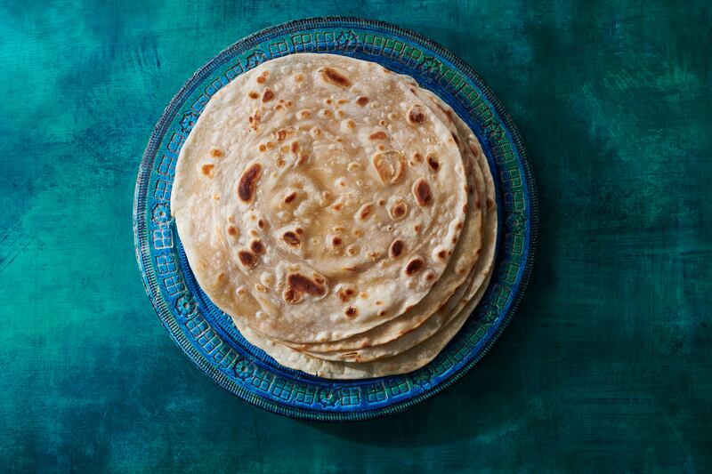 You can use store-bought chapati for a rolex, but a homemade one makes it particularly special. Photograph: Kelly Marshall for The New York Times