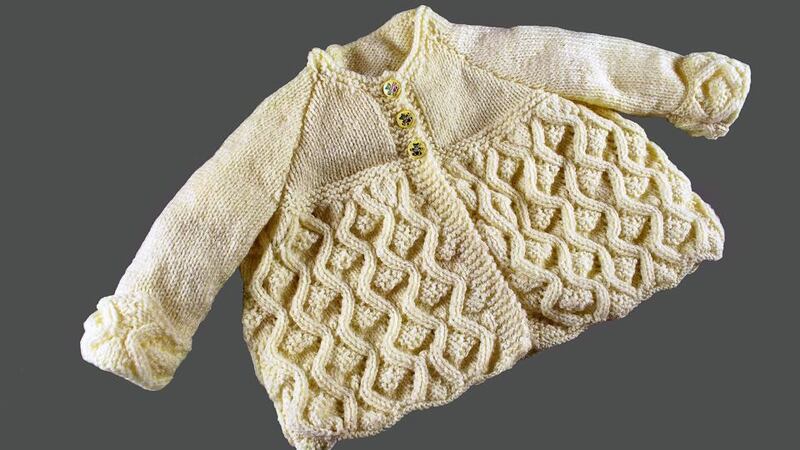 WHITE CARDIGAN: “This one now I just kept for myself; I suppose it’s my memory of him. It’s sitting in the press in the kitchen .” – Mary