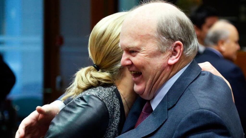 Minister for Finance Michael Noonan greets his Finnish counterpart Jutta Urpilainen (left) during a European Union finance ministers meeting in Brussels last night. Photograph: Francois Lenoir/Reuters.