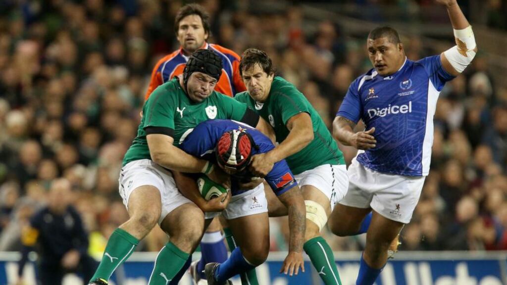 Ireland’s Mike McCarthy and Mike Ross make one of the home side’s 163 tackles against Samoa last week. The visitors made 90 tackles. Photograph: Ryan Byrne/Inpho