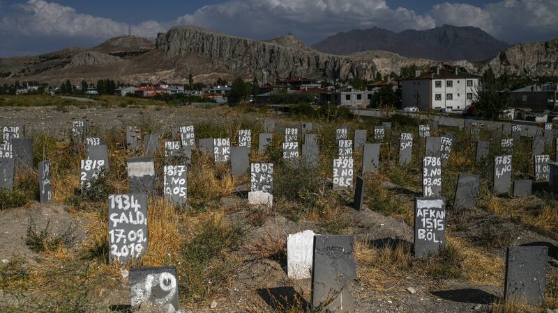 Gravestones of unidentified migrants in Van, eastern Turkey, who died after crossing the Turkish-Iran border. Photograph: Ozan Kose/AFP via Getty Images