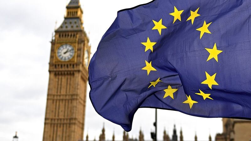 The EU flag flies in front of the British parliament.  File photograph: Andy Rain/EPA