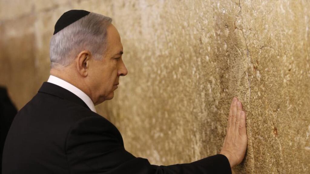 Israeli Prime Minister Benjamin Netanyahu touches the Western Wall in Jerusalem. Photograph: Abir Sultan/EPA