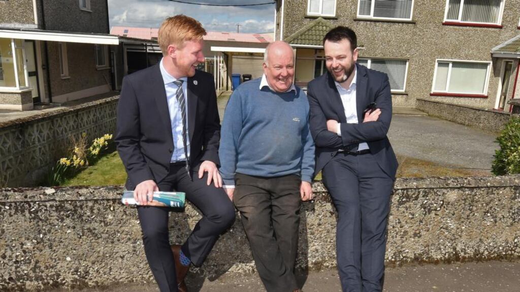 The SDLP’s Daniel McCrossan (left), local man Eamon Holland (centre), and SDLP leader Colum Eastwood during canvassing in Strabane